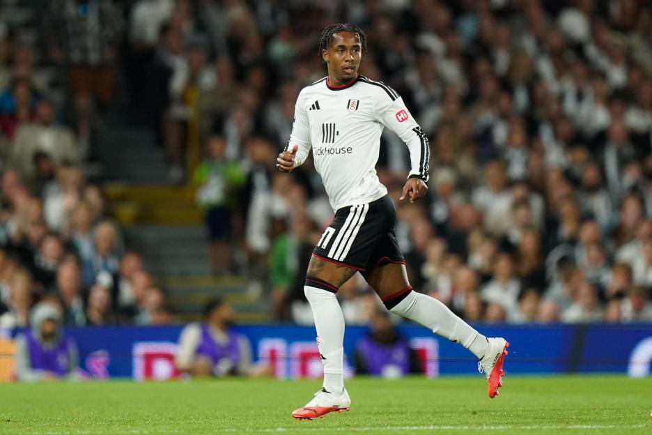 Kevin of Fulham in a white jersey and black shorts during a Premier League match.