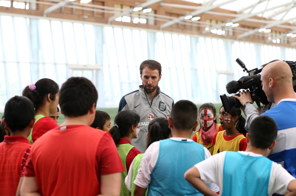 England U21 Manager Gareth Southgate talking to children at a training session.