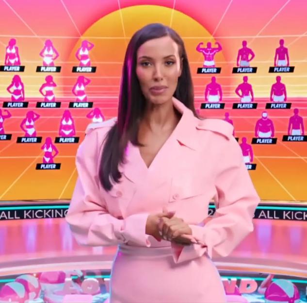 Maya Jama in a pink outfit, standing in front of screens showing silhouettes of Love Island contestants.