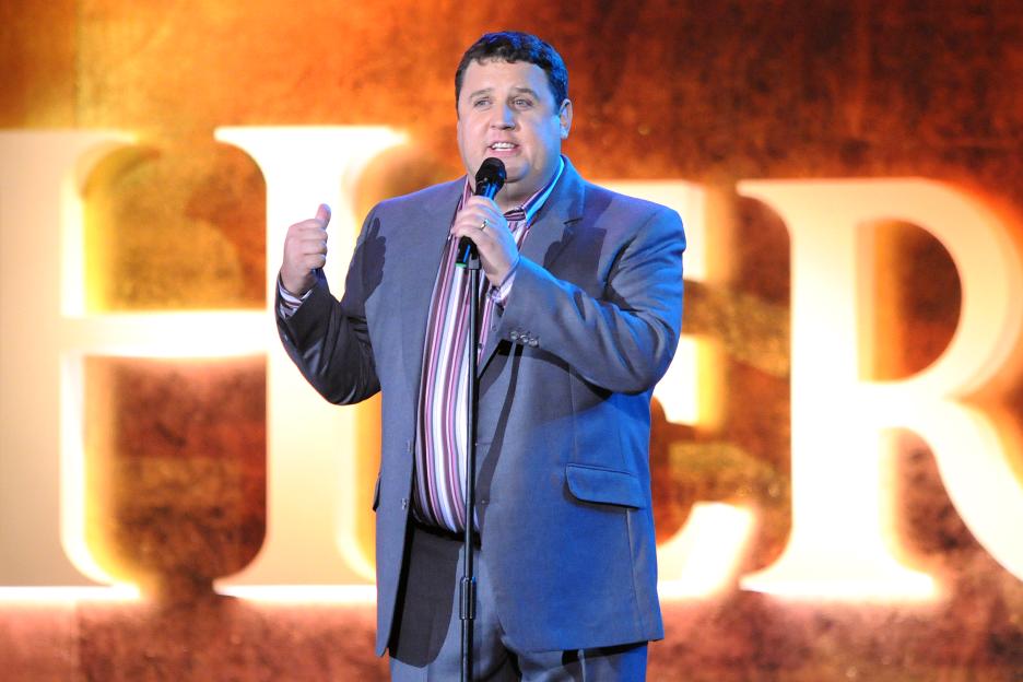 Comedian Peter Kay performing live on stage.