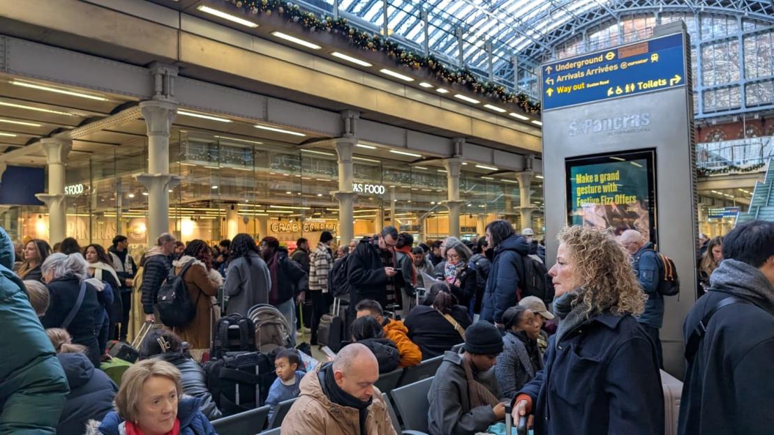 Crowd of people at St Pancras International station.