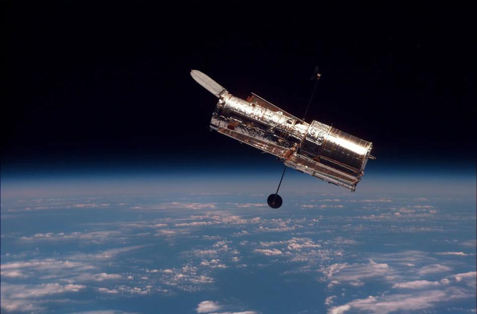Hubble Space Telescope orbiting above Earth.