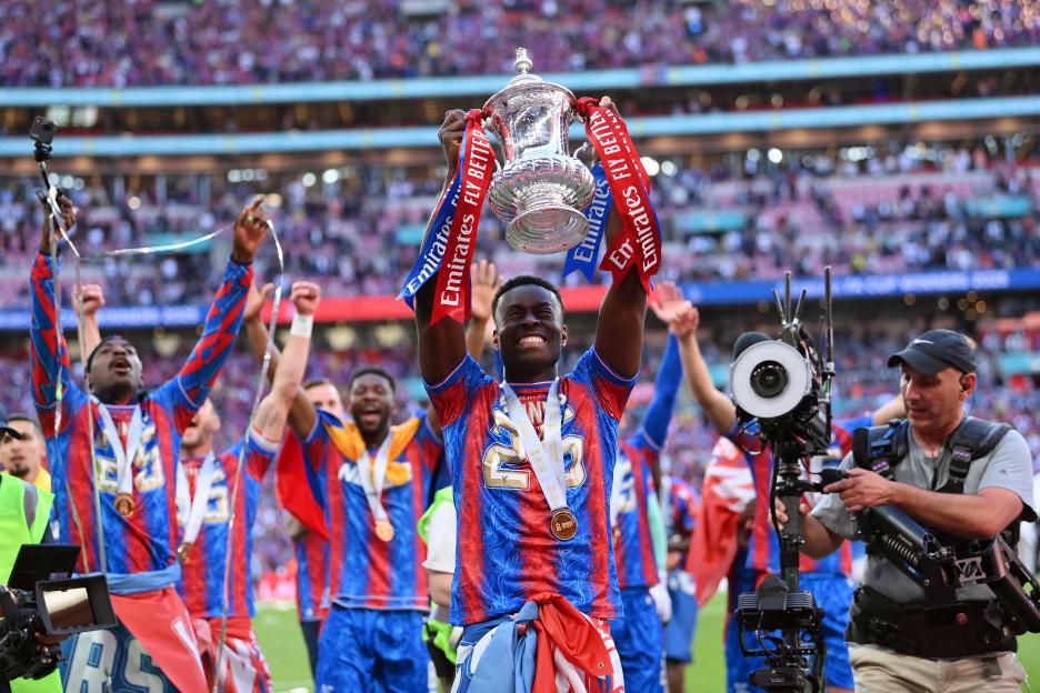 Marc Guehi of Crystal Palace celebrates with the FA Cup trophy.