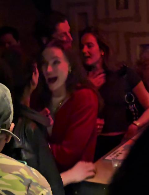 Sophie Turner smiling at a party.