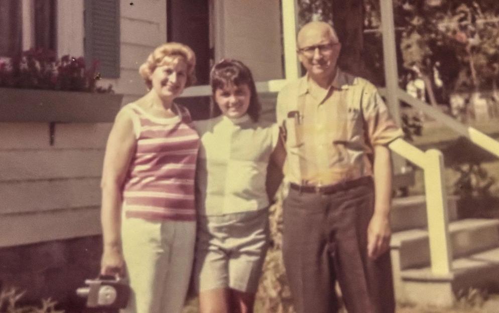 Diana, Manny, and Ethel standing on a porch.