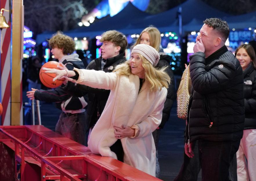 Kate Garraway playing a basketball game at Winter Wonderland.