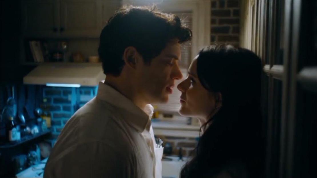 Clark Kent and Lois Lane almost kissing in a kitchen.