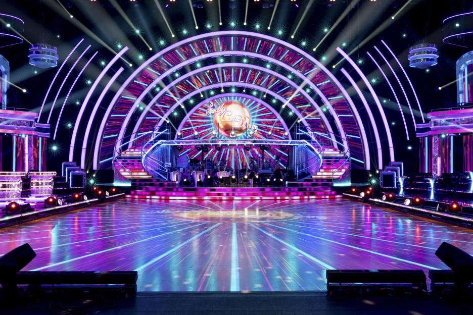 The new set for Strictly Come Dancing, featuring a large dance floor with light projections, an ornate staircase, and the show's signature illuminated archway.