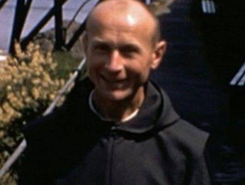 Father Thaddeus Kotik at Caldey Island abbey ruins.