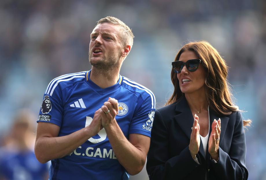 Jamie Vardy and his wife Rebekah acknowledge fans during a lap of honor.