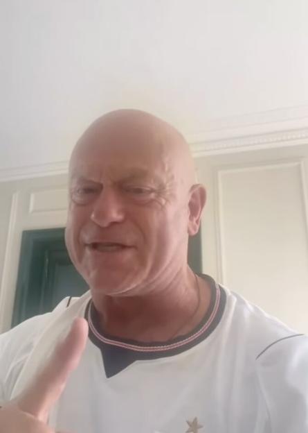 Ross Kemp in a white shirt, passionately reacting to an England win.