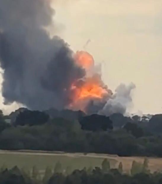 Smoke and flames rising into the sky from an explosion in Rettendon Way.
