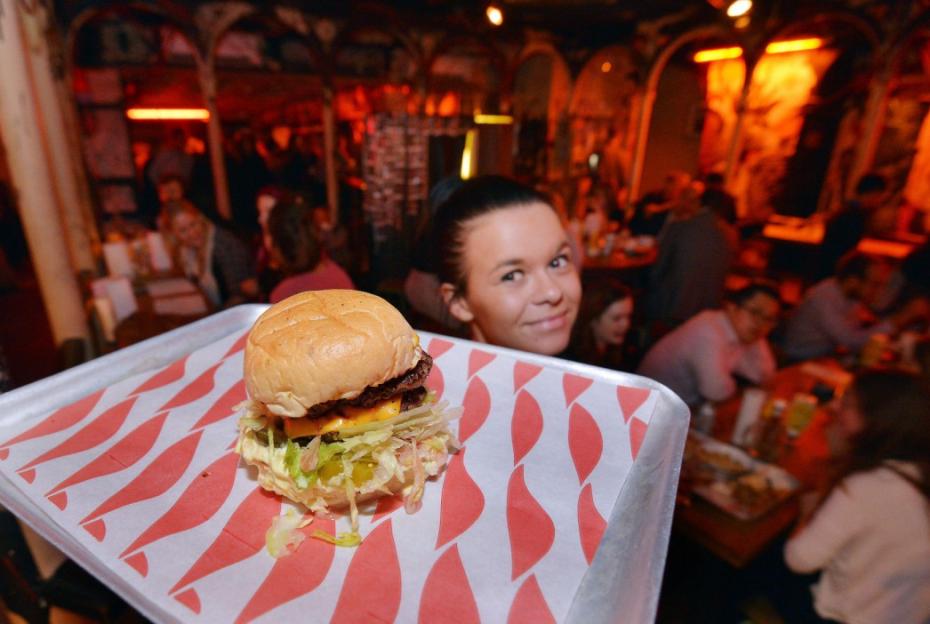 The Dead Hippie burger from MEATLiquor, served on a tray with a patterned liner.