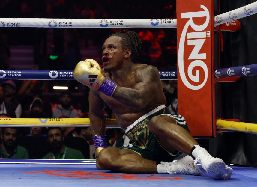 Anthony Yarde sits on the boxing ring floor, dejected after losing to David Benavidez by technical knockout.