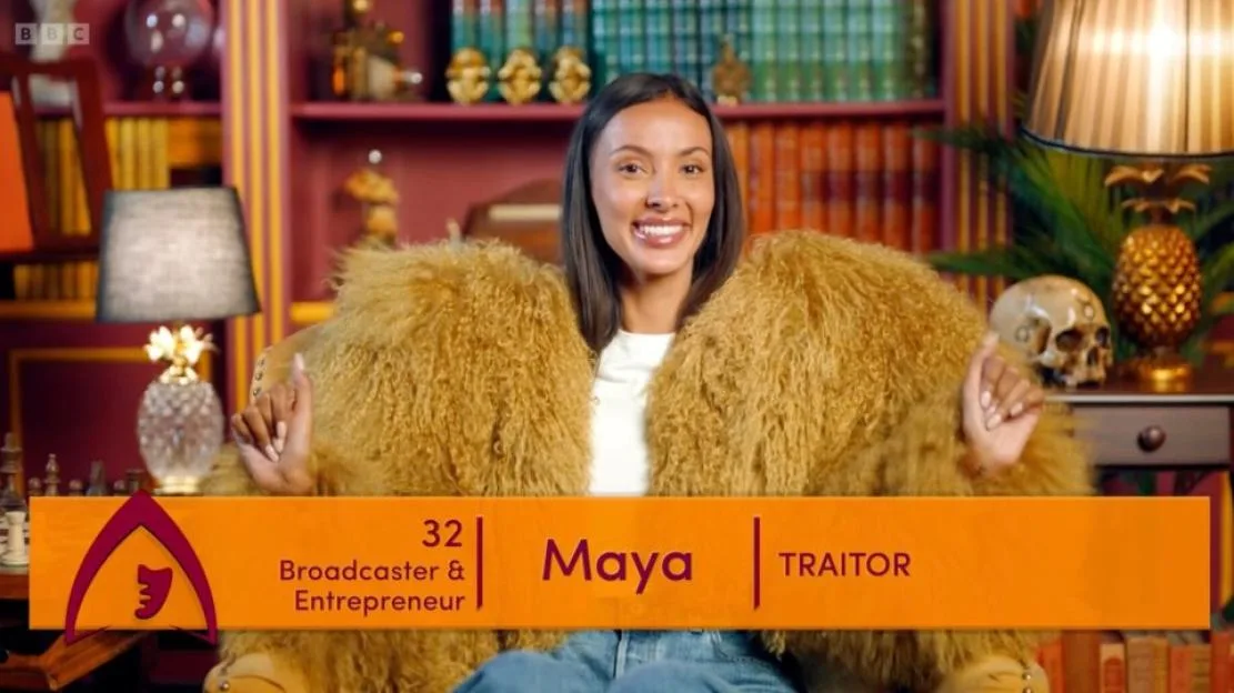 Maya Jama wearing a shaggy mustard coat on Celebrity Traitors.