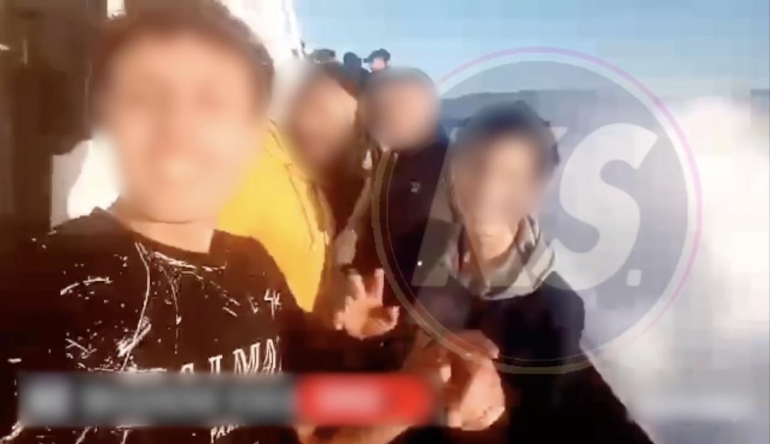 Blurred image of migrants on a boat.