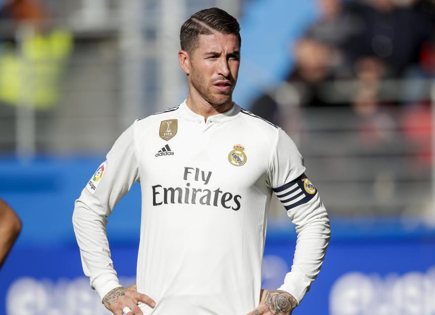 Sergio Ramos of Real Madrid in a white jersey on the field.