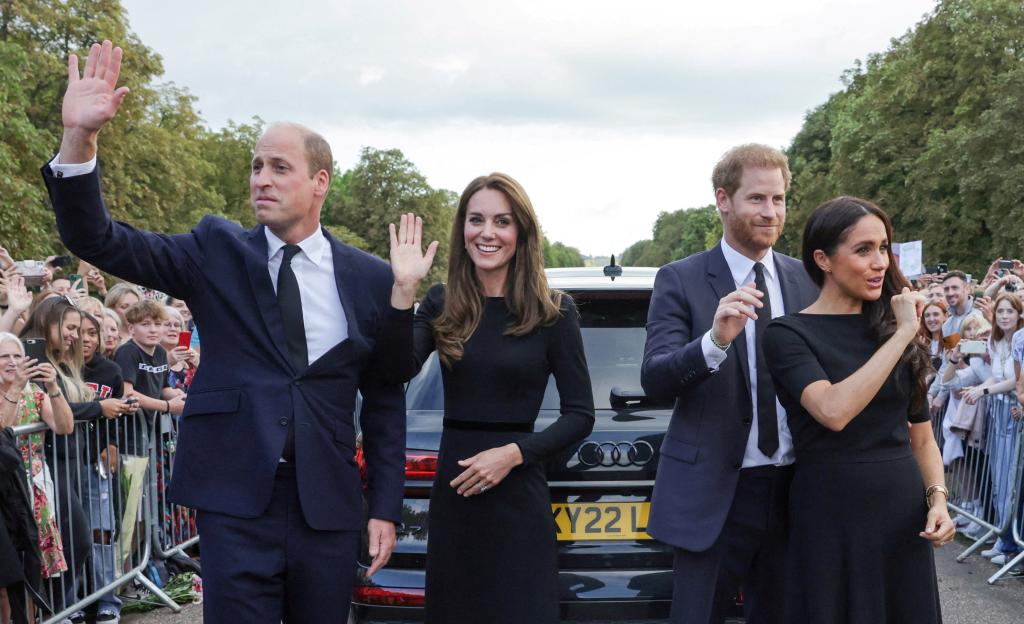 Britain's William, Prince of Wales, Catherine, Princess of Wales, Britain's Prince Harry and Meghan, the Duchess of Sussex, wave to the public.