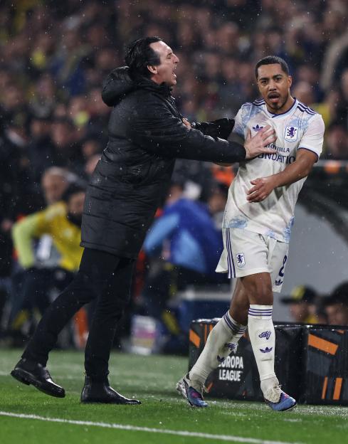 Aston Villa manager Unai Emery and midfielder Youri Tielemans clash during a soccer match.