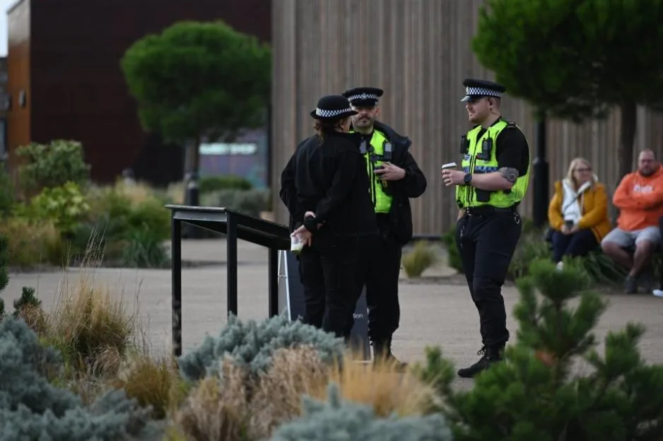 Police officers standing at Yorkshire Wildlife Park during an emergency incident.