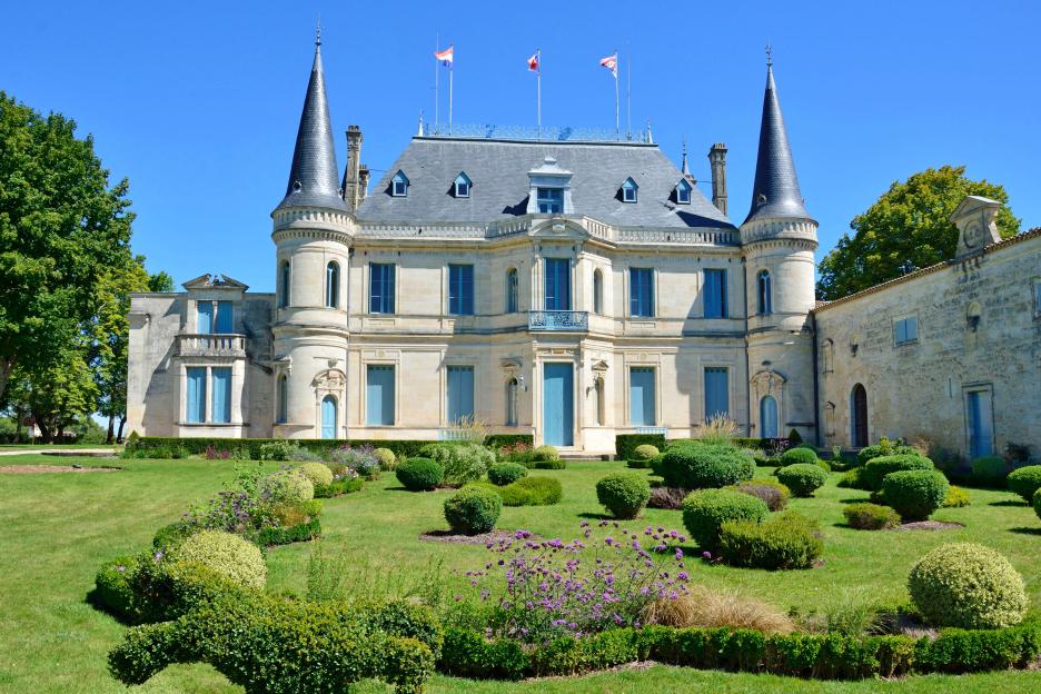 Chateau Palmer in Margaux, Medoc region of Gironde, France, with manicured gardens in the foreground.