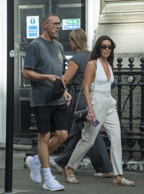 Paddy McGuinness and Emma Carey walking through Covent Garden.