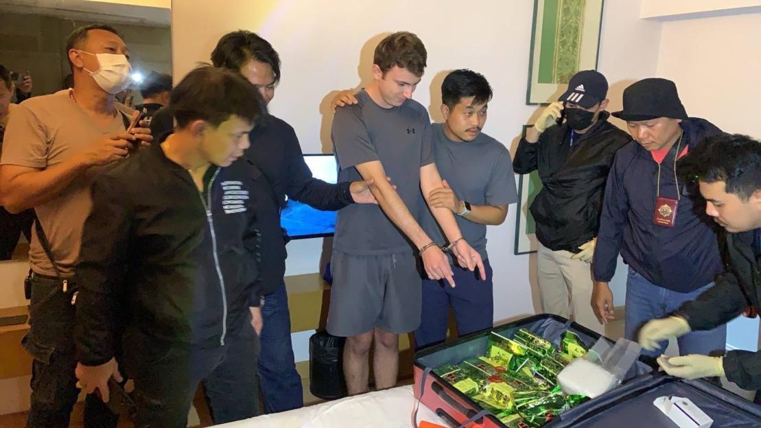 George Wilson being arrested in Thailand with a suitcase full of crystal meth.