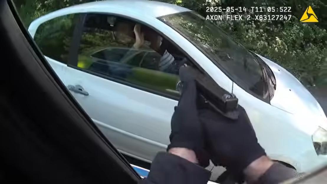 'Watch as Armed Officer Dramatically Stops Burglars by Aiming Handgun from Moving Car!'