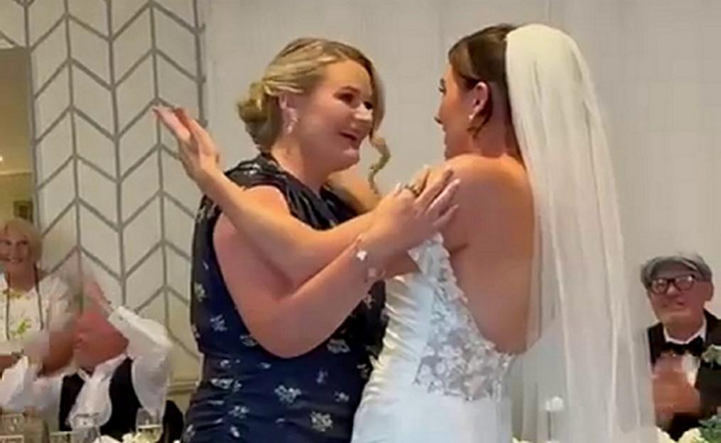 Jess returning the ring to Abi during her wedding ceremony.