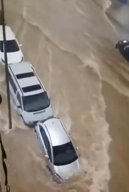 **FULL COPY BY GERARD COUZENS.-TEL: +34 659 567 821**.VALENCIA FLOOD HORROR: Streets turned into raging rivers as cars and buildings swamped
