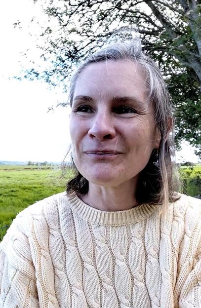 Michele Akester-Marsh speaking outdoors.