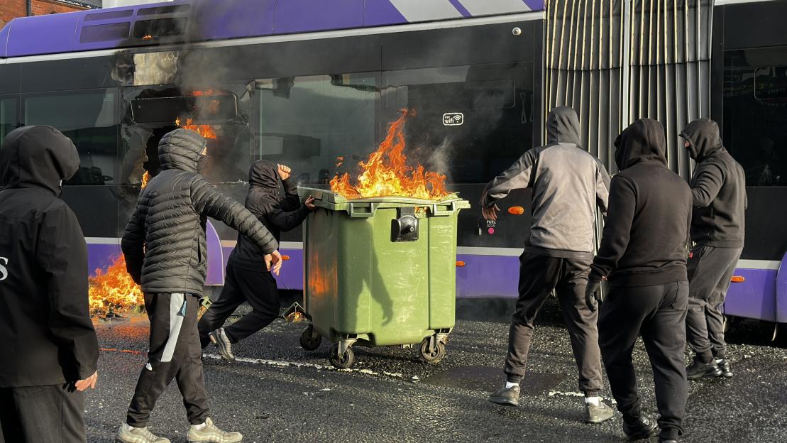 A bus set on fire by protesters during an anti-immigration demonstration in East Belfast.