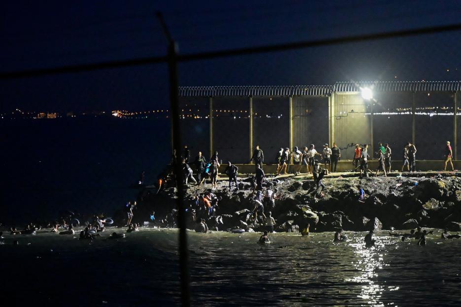Migrants swim to Spain's Ceuta in mass border crossing