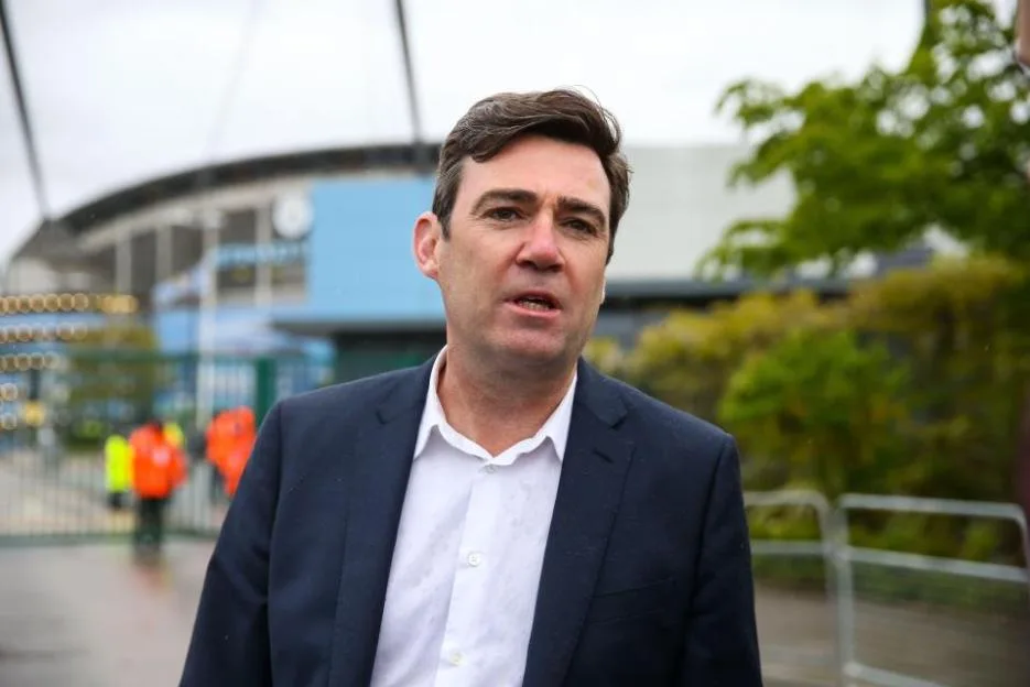 Mayor of Greater Manchester Andy Burnham speaking to a reporter at the Etihad Stadium.