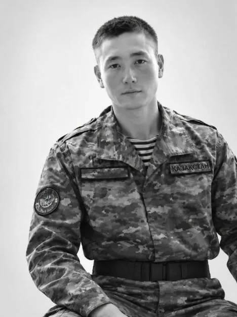 Black and white photo of 19-year-old Kazakh conscript sailor Omirbek Omirzak in military uniform.