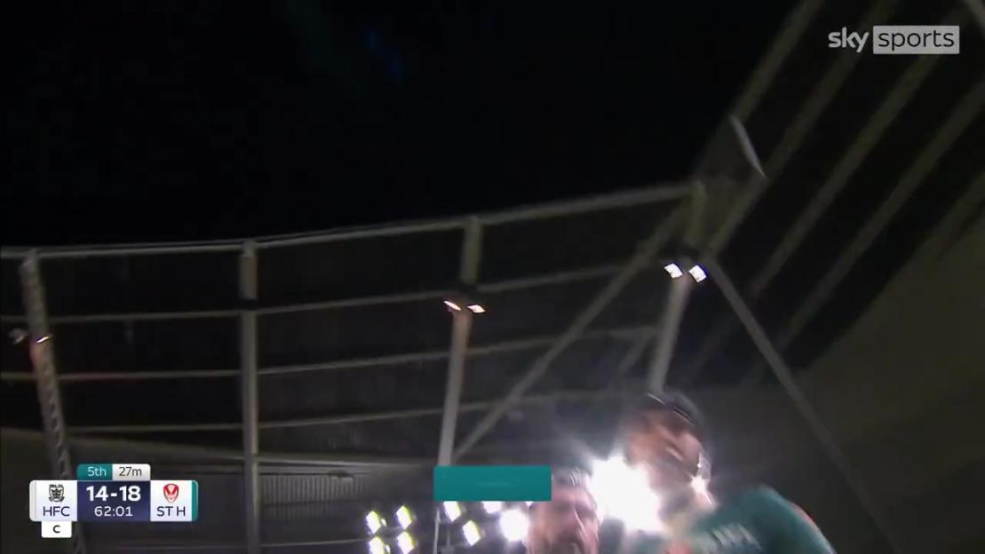 A camera operator falling over during a rugby league game.