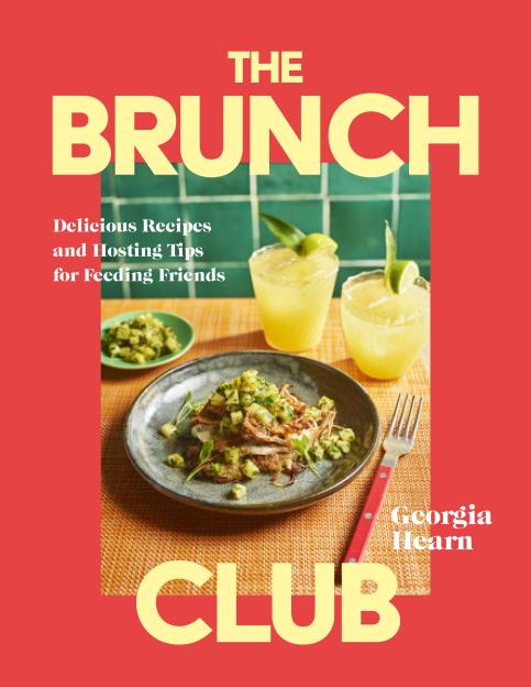 The Brunch Club cookbook cover with a dish of pulled pork and salsa, and two yellow drinks with lime wedges.