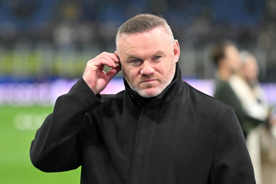 Former England player Wayne Rooney looks on prior to a UEFA Champions League match.
