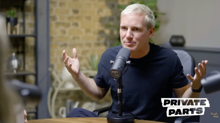 Jamie Laing gestures while hosting the Private Parts Podcast.