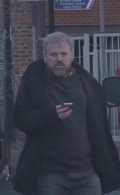 Donald McPherson holding a phone.