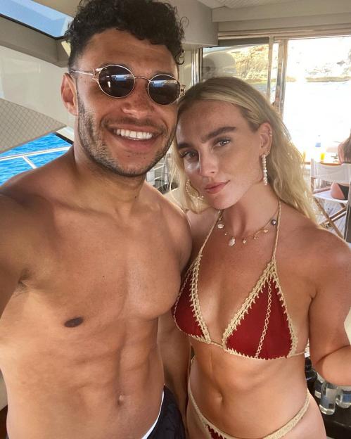 Perrie Edwards and Alex Oxlade-Chamberlain on a boat.