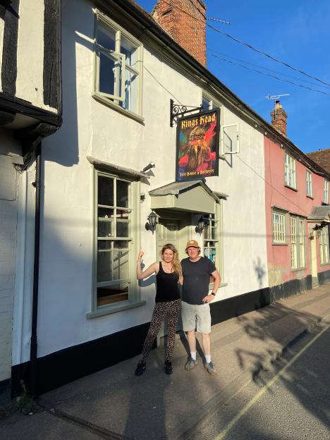 Landlords Pete Goss and Sophie McCreddie stand outside their pub, the Kings Head.