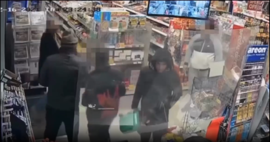 CCTV footage of men in a convenience store.