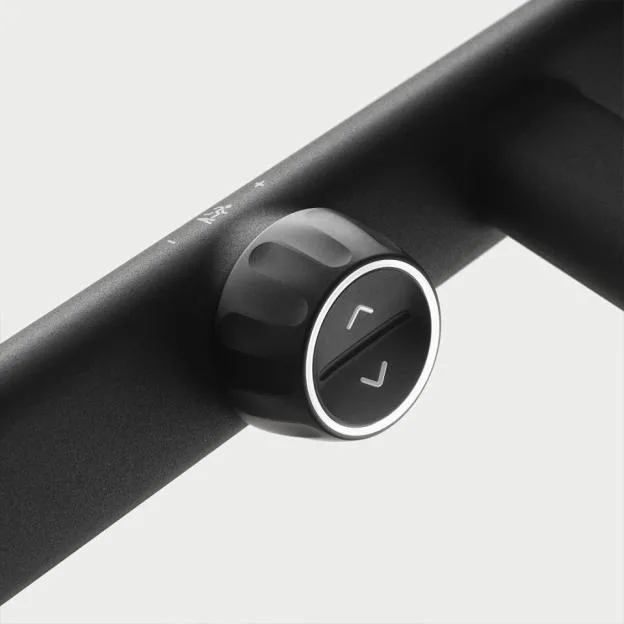 Buttons on a Tonal handle to adjust weight.