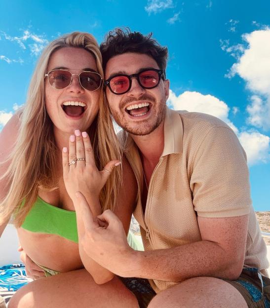 Sian Welby and Jake Beckett show off Sian's engagement ring.