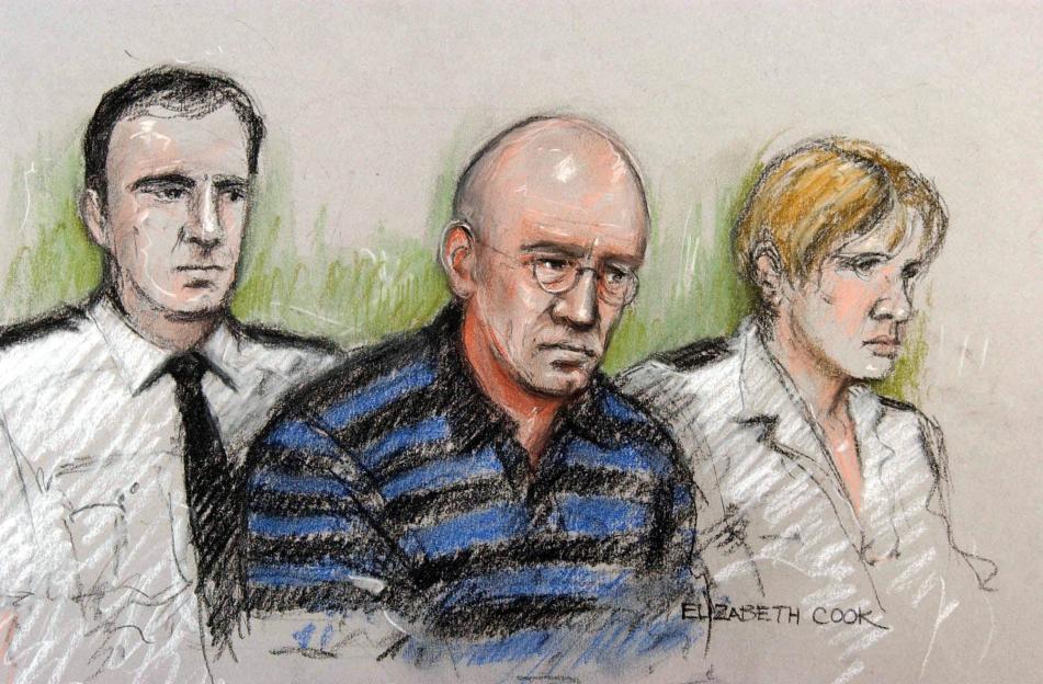 Illustration of Michael Stone, shaven-headed and wearing glasses, appearing in court, flanked by security personnel.