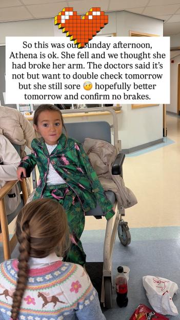A young girl in green pajamas sitting in a hospital wheelchair with text overlay explaining she had a fall.