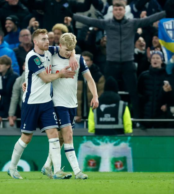 Lucas Bergvall and Dejan Kulusevski of Tottenham Hotspur celebrating a goal.