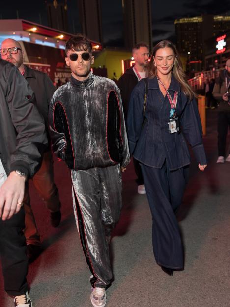 Loved-up Zara McDermott hand in hand with Louis Tomlinson as they make rare public appearance at F1