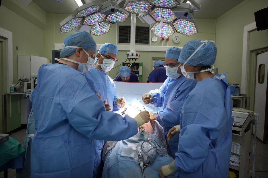 A surgeon and their team performing keyhole surgery to remove a gallbladder at The Queen Elizabeth Hospital in Birmingham, England.